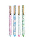 Four floral-patterned pens with colored caps and bases on a white background