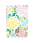 Floral patterned notebook with a decorative button on a white background