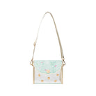 Small handbag with gold accents and a light blue flap on a white background