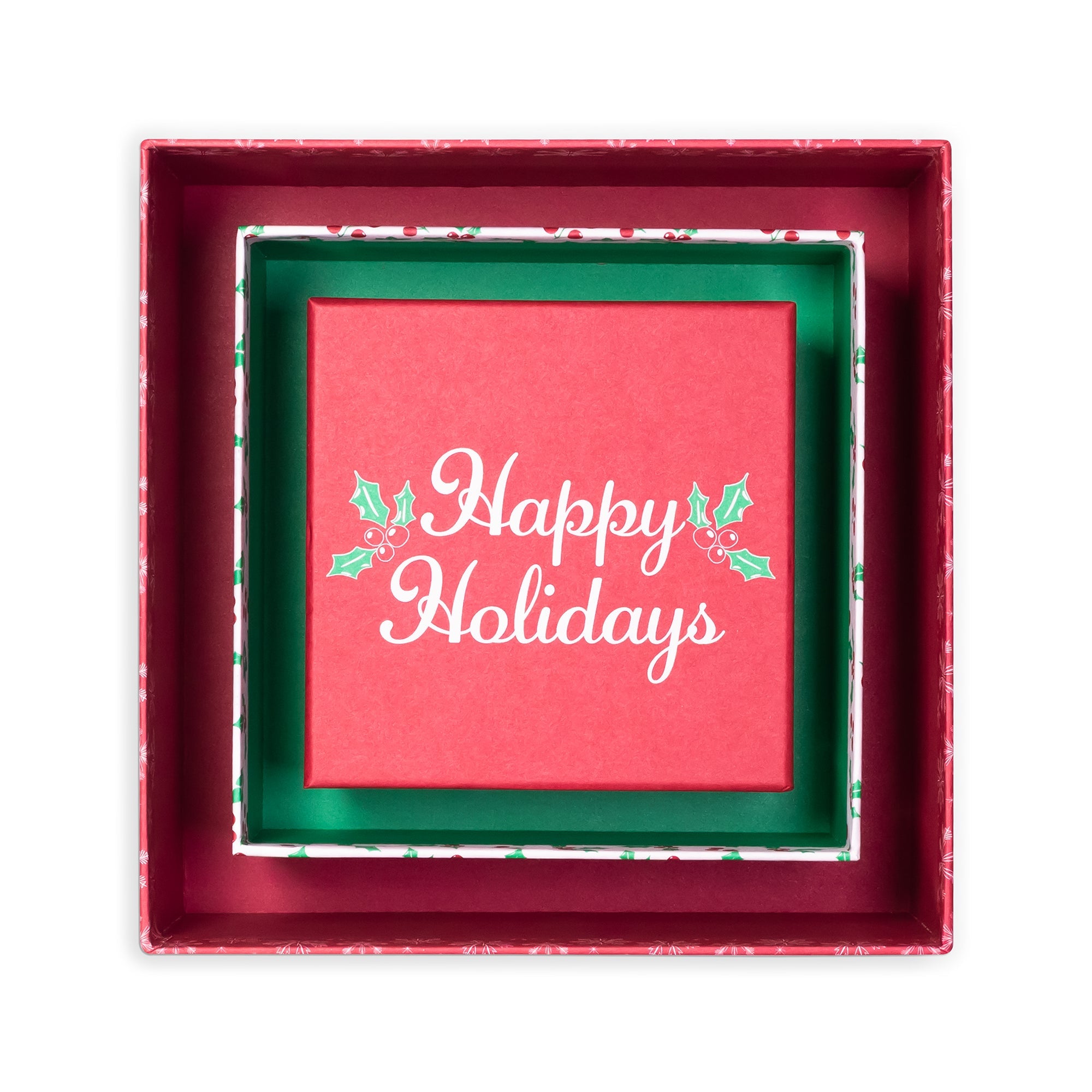 A square red gift box with a red interior, featuring a green inner liner and a red card in the center that reads 'Happy Holidays' in white script with small holly accents.