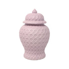 Pink ceramic jar with a lid on a white background