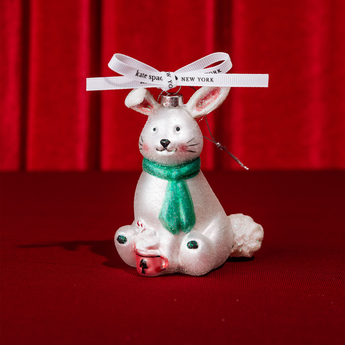bunny glass ornament on a red ground