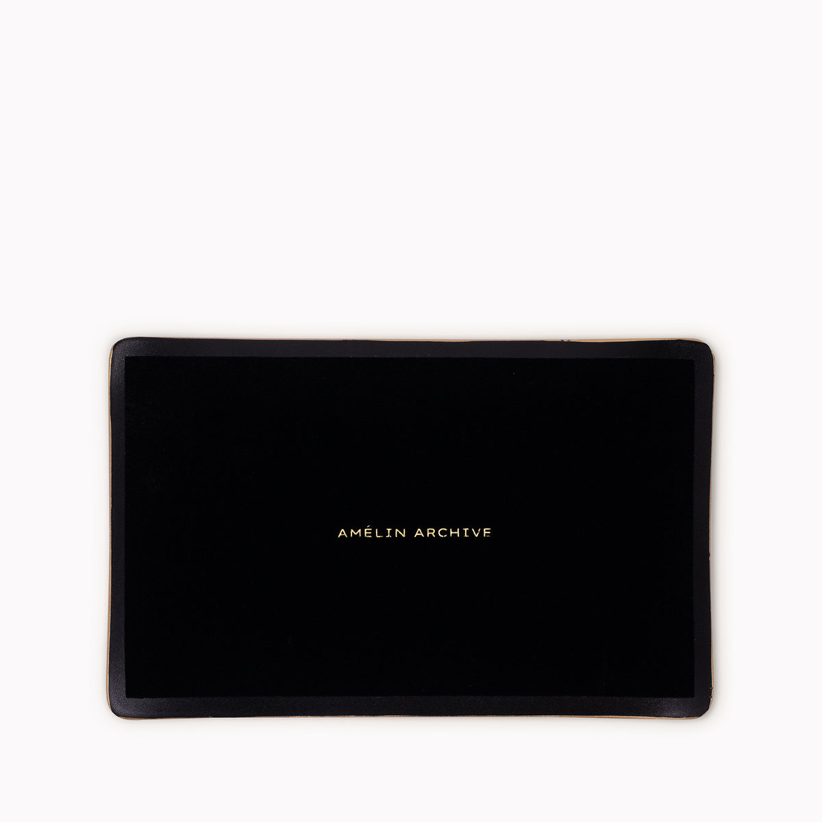 A black rectangular tray with a gold metallic border and the text 'AMELIN ARCHIVE' printed in gold at the center, shown against a plain white background.