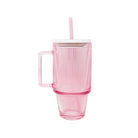 Pink mug with handle and straw on a white background