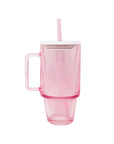 Pink mug with handle and straw on a white background