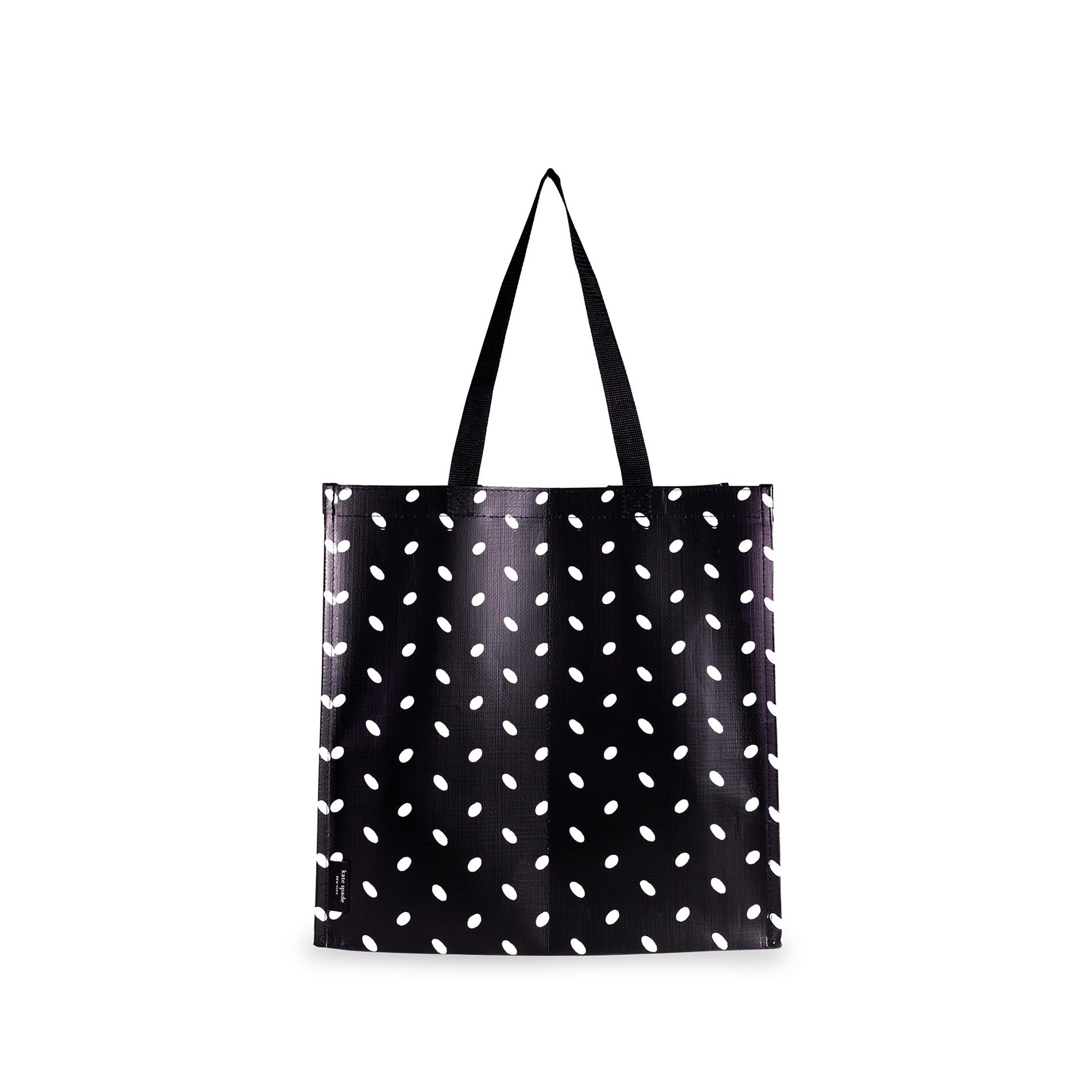 Black tote bag with white polka dot pattern on a white background