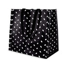 Black tote bag with white polka dot pattern on a white background