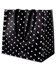 Black tote bag with white polka dot pattern on a white background