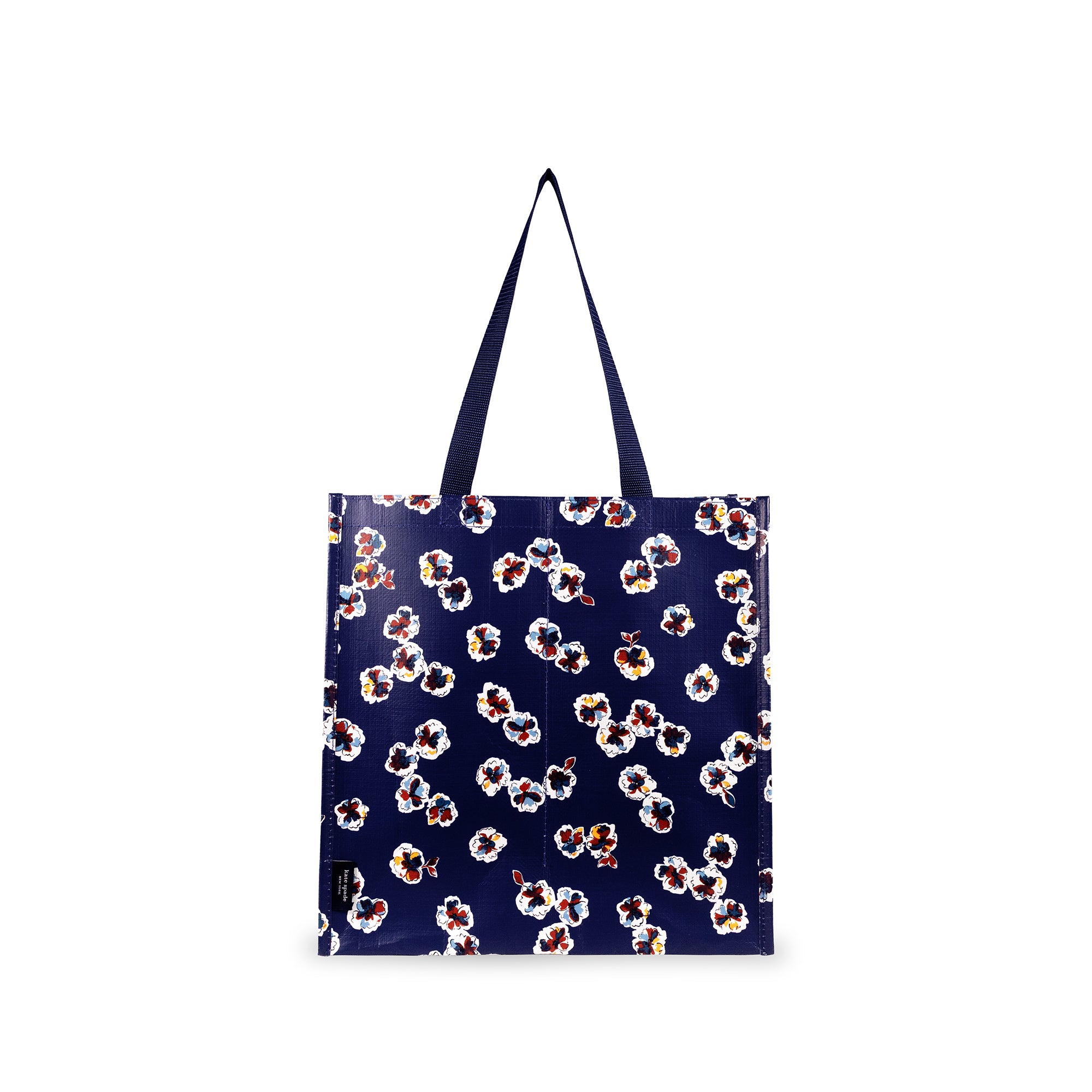 A navy blue tote bag with a repeating white, red, and yellow floral pattern, featuring two dark blue shoulder straps, shown against a plain white background.
