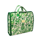 A green and cream botanical print travel bag with dark green trim, top handles, and a small gold-tone brand plaque on the front.