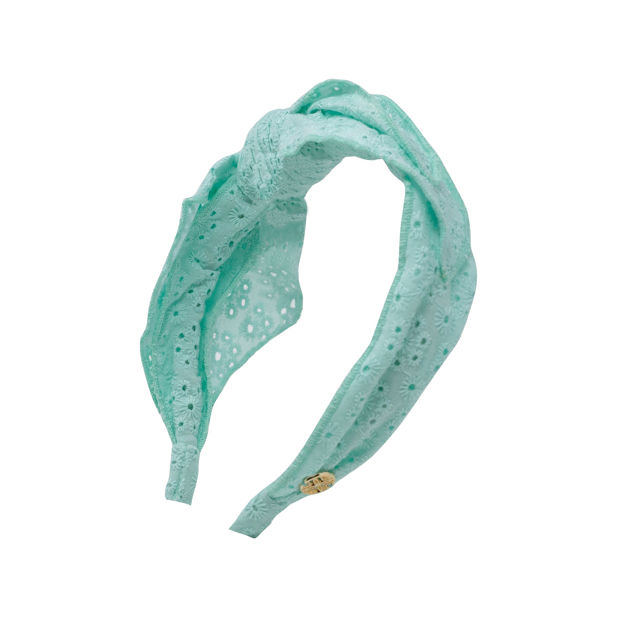 Turquoise headband with a small button on a white background