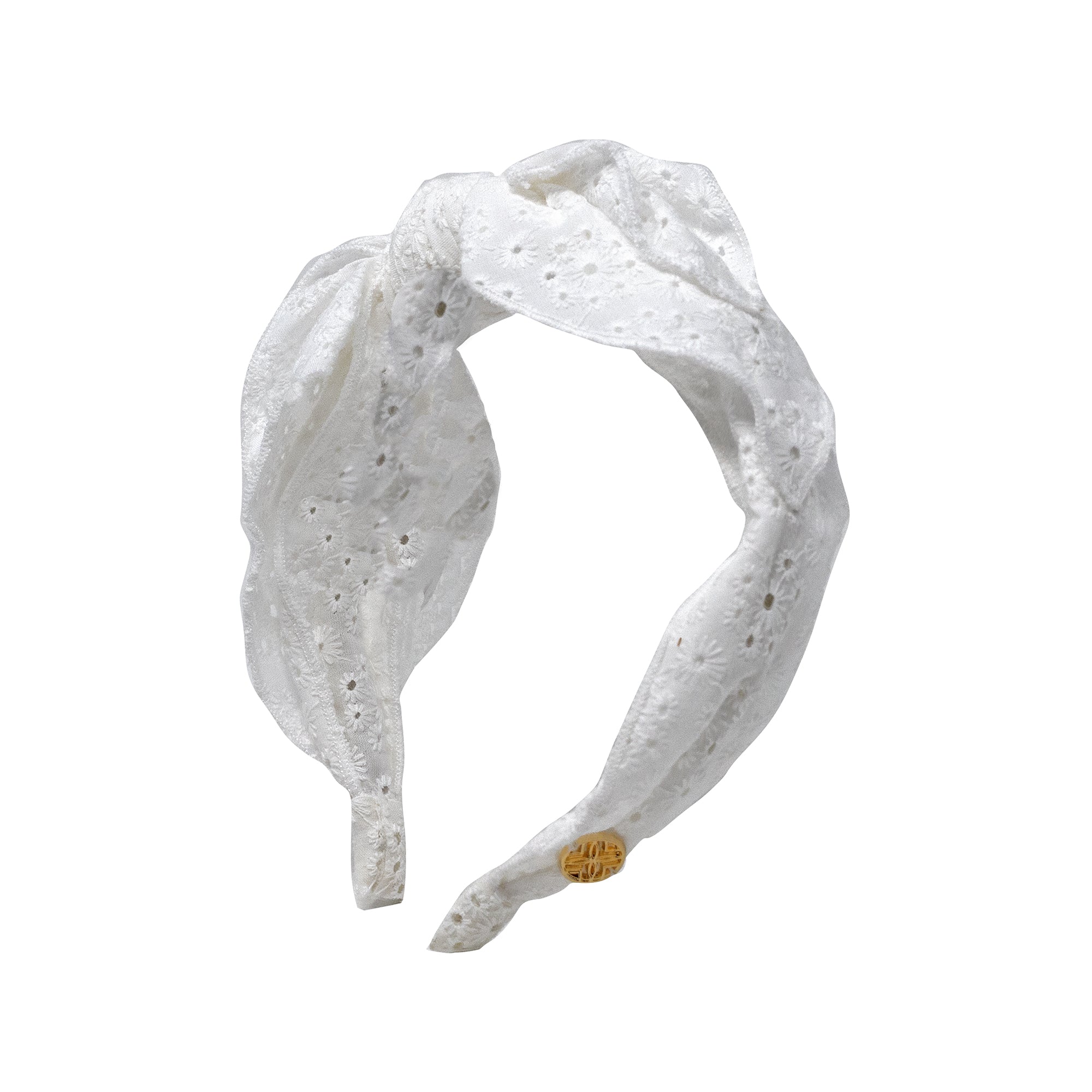 White lace headband with a bow on a white background
