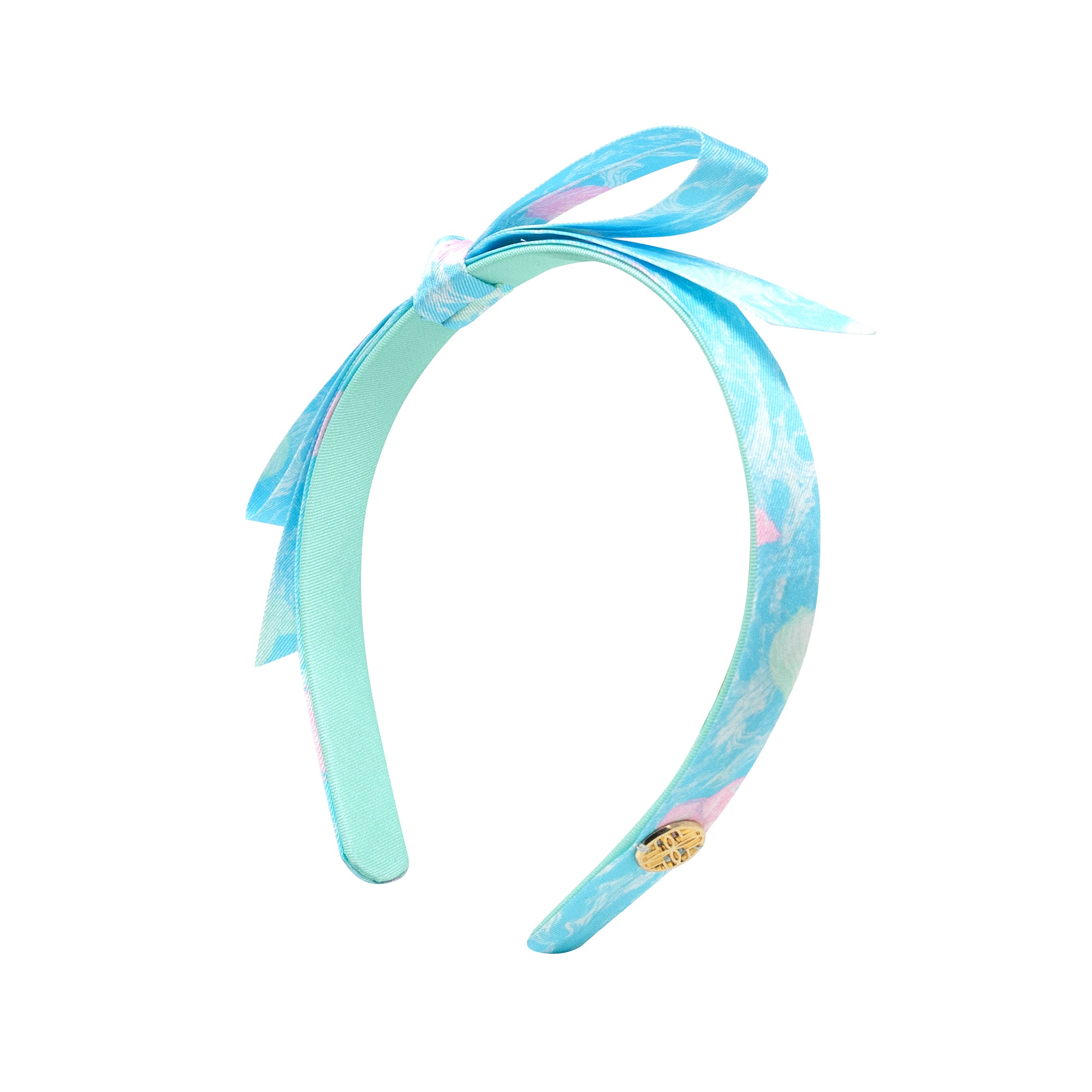 Turquoise headband with a bow on a white background