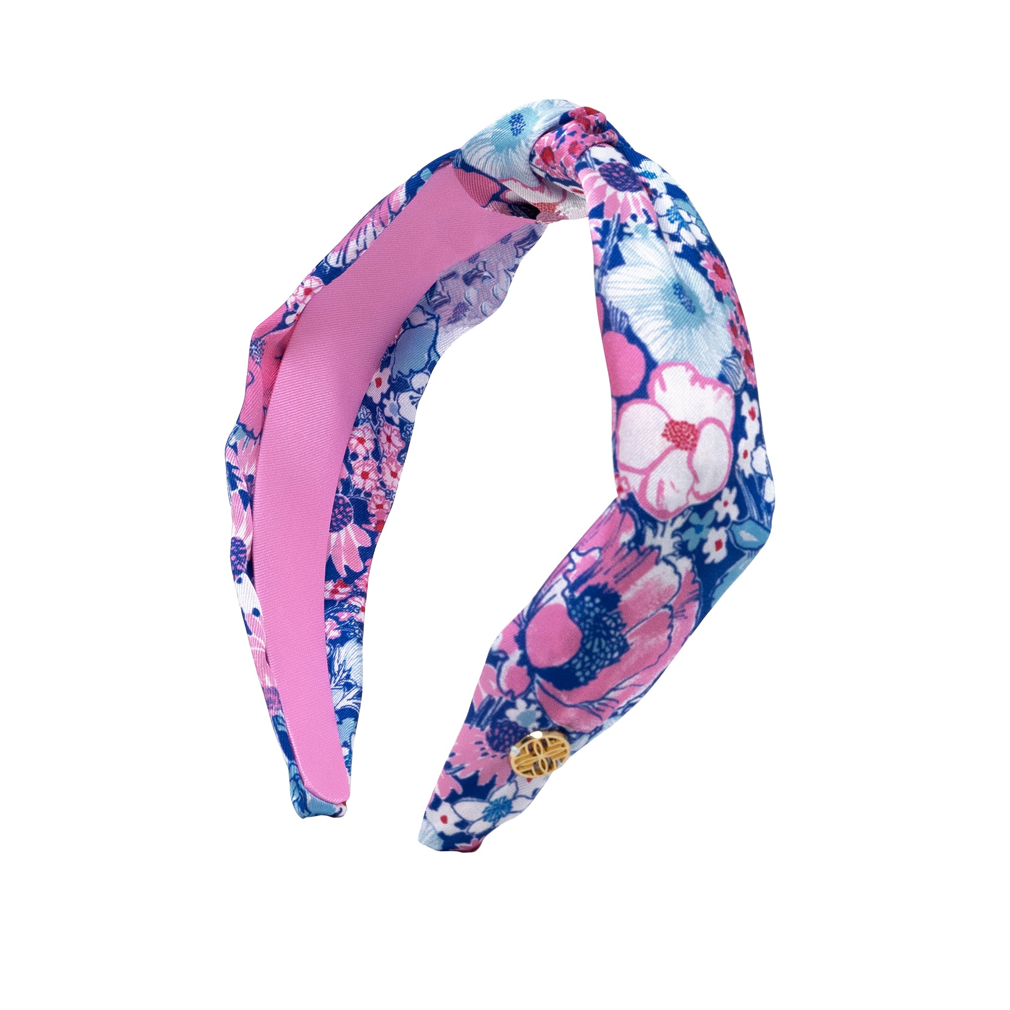 Floral headband with pink accents on a white background