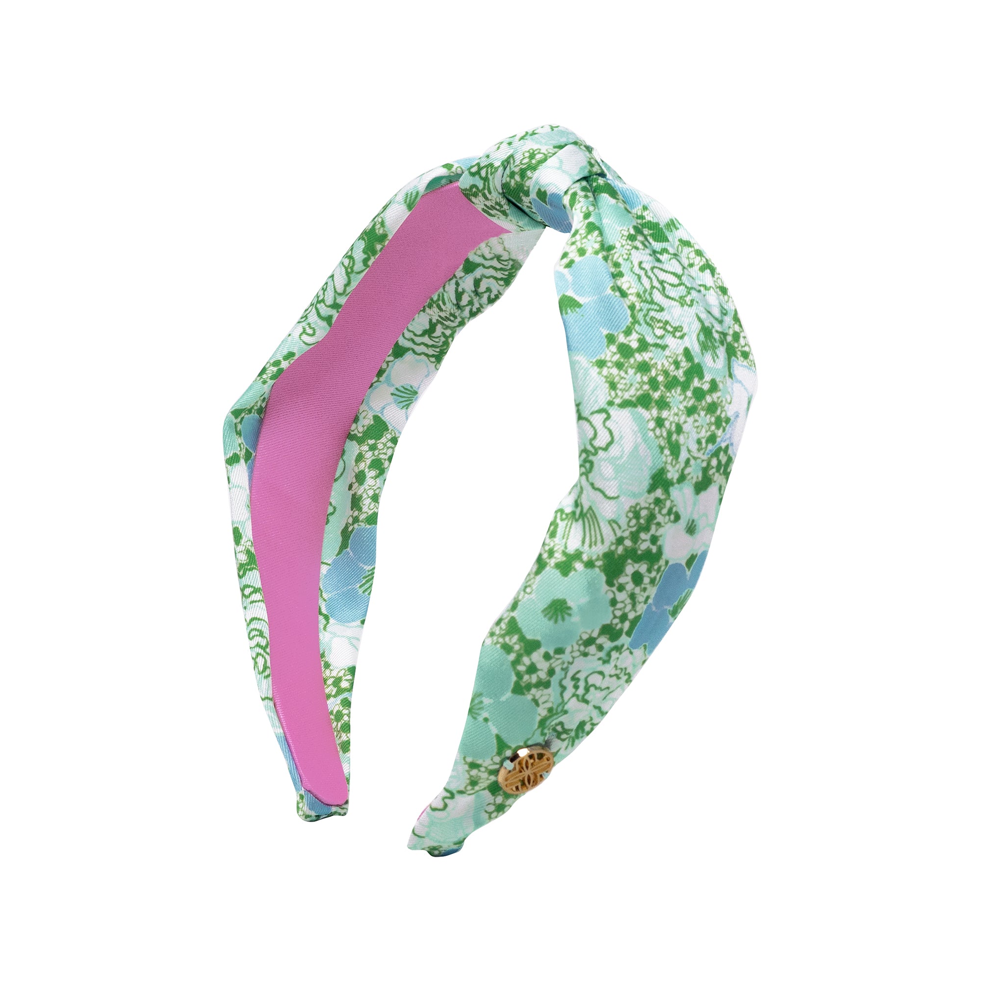 Floral patterned headband with a pink center on a white background