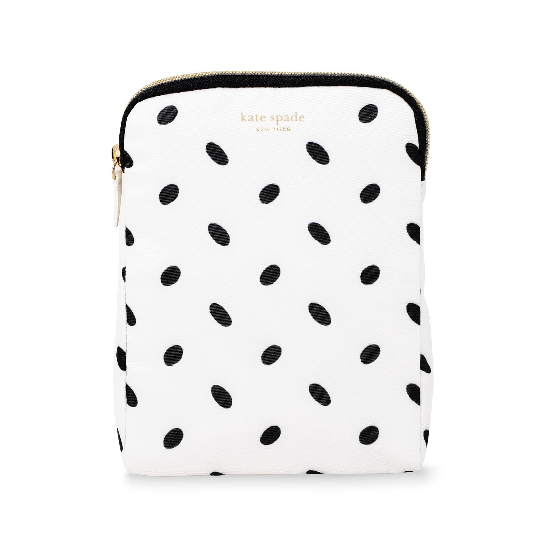 White pouch with black polka dot pattern and 'kate spade' branding on a white background