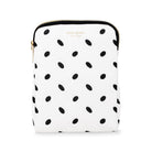 White pouch with black polka dot pattern and 'kate spade' branding on a white background