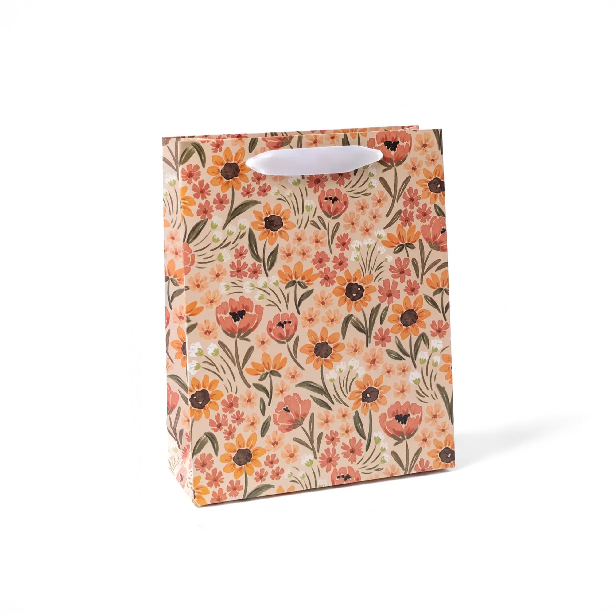 Tan large gift bag with white handles and all over poppy and orange floral print