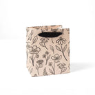 Tan small gift bag with black handle and sketched floral print