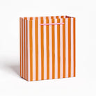 Large pink and orange vertical stripe gift bag with pink handle