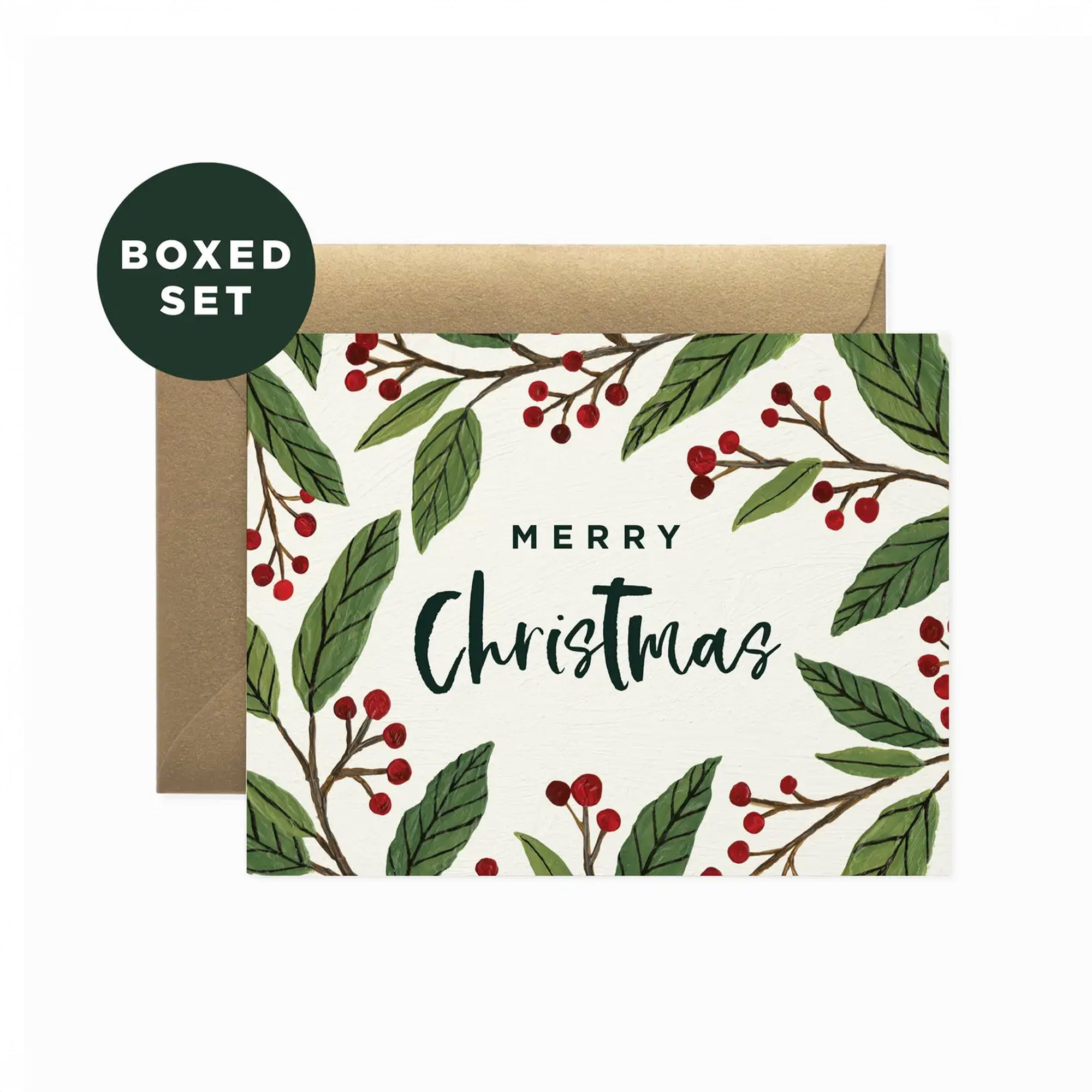 Christmas card with green leaves and red berries and a brown envelope with 'Merry Christmas' on a white background