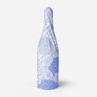 Bottle wrapped with white and lavender floral tissue paper