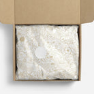 Decorative tissue paper with gold floral pattern in a box