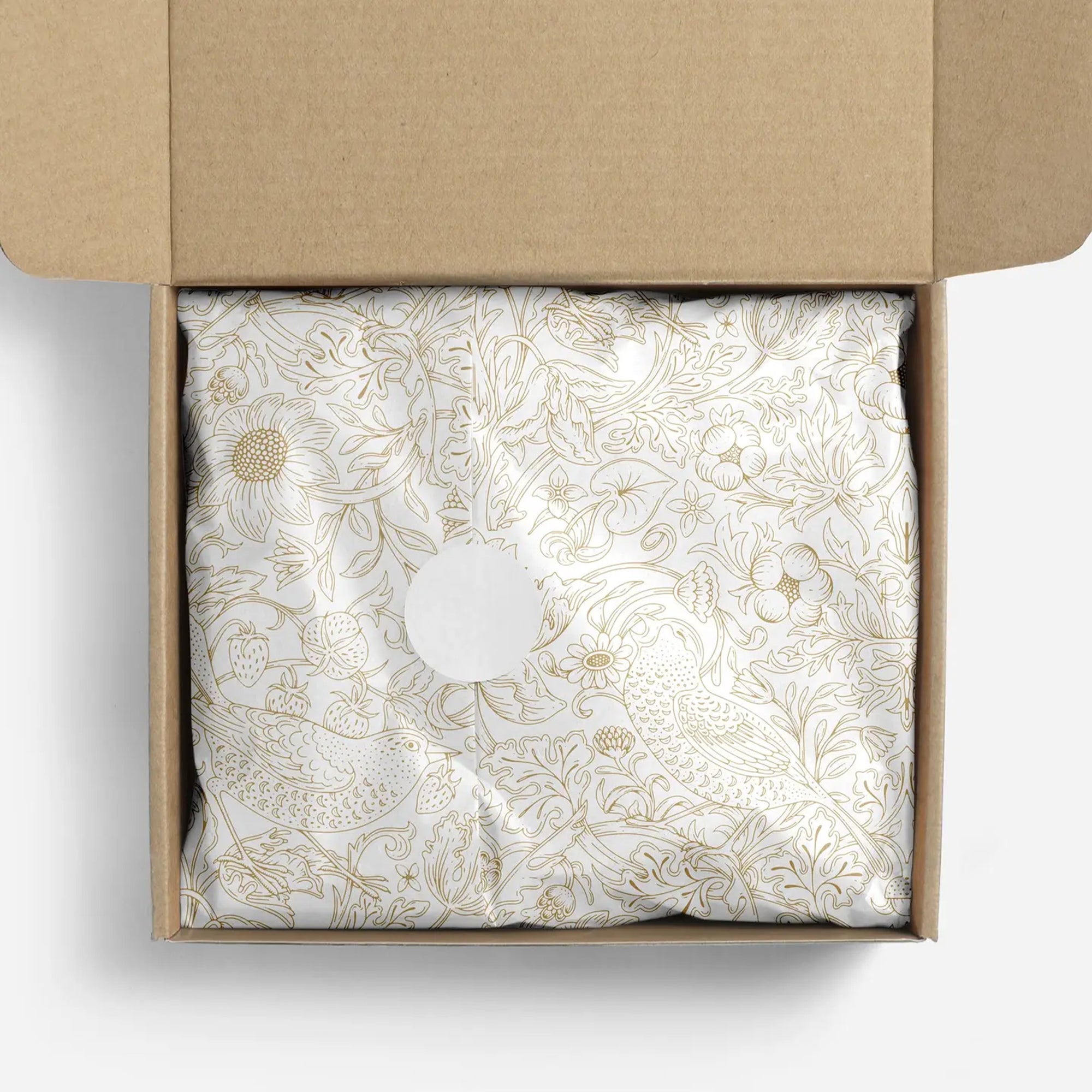 Decorative tissue paper with gold floral pattern in a box