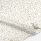 Up close of decorative tissue paper with gold floral pattern