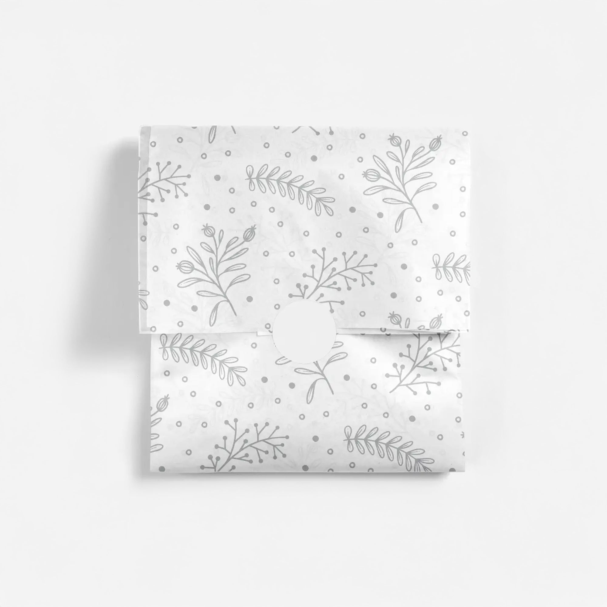 Silver floral patterned tissue paper on a white background