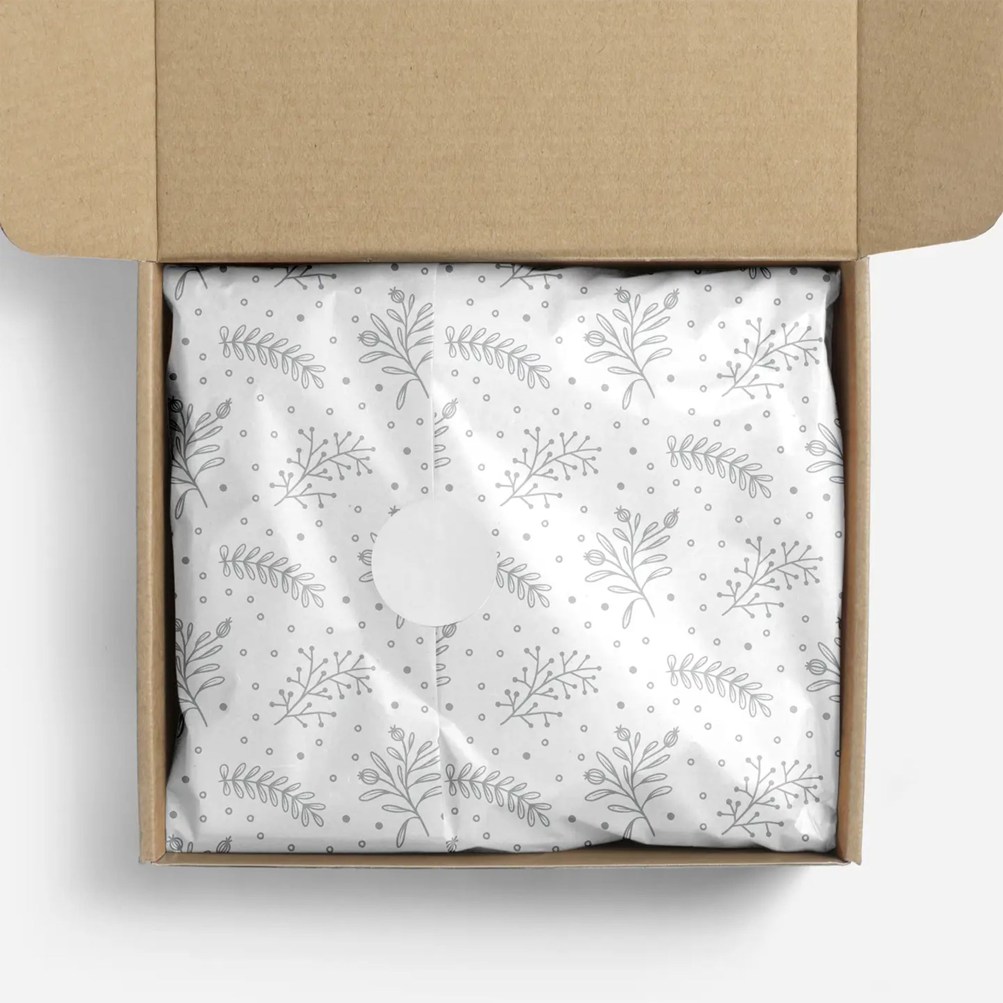 Silver floral patterned tissue paper in a box