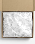Silver floral patterned tissue paper in a box