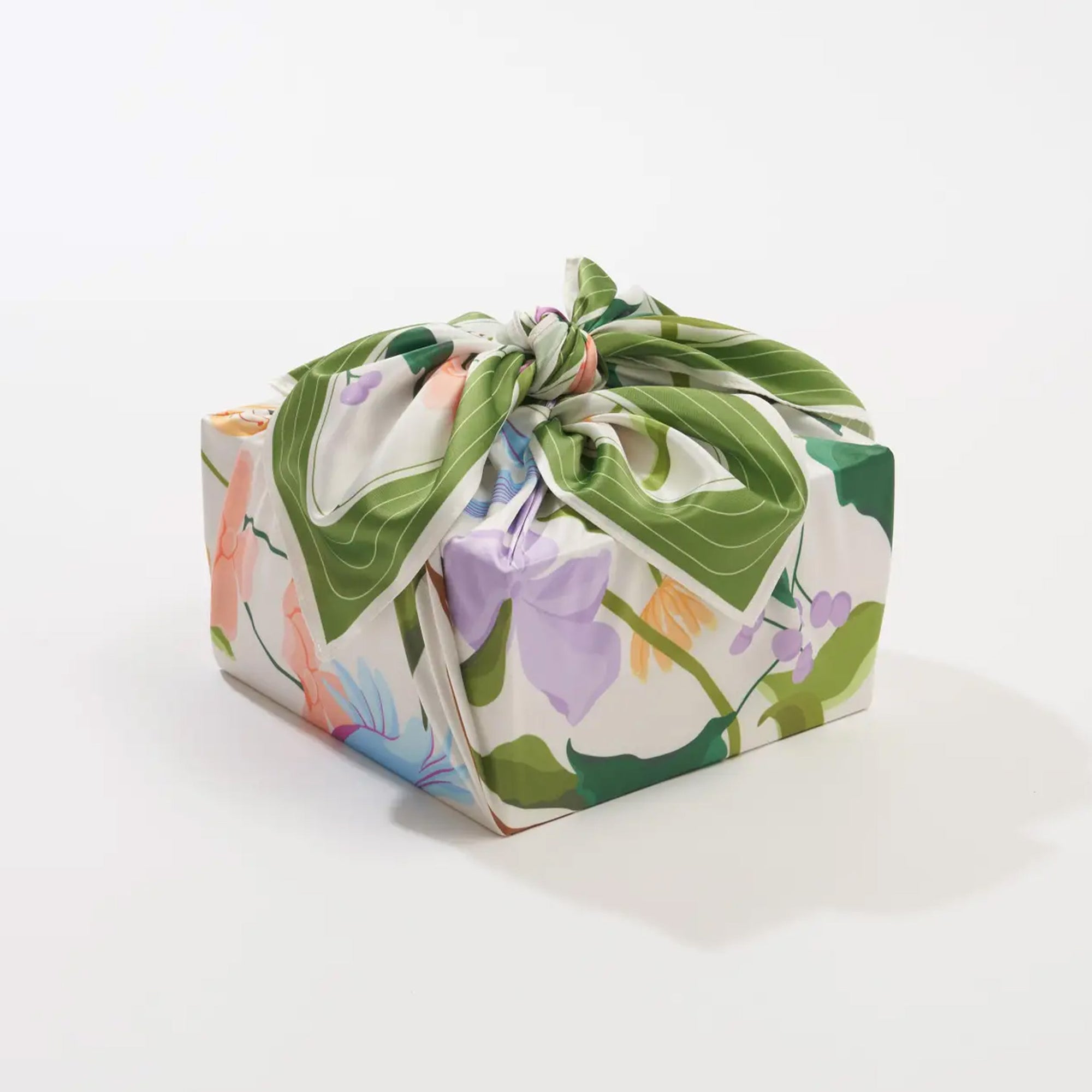 Rectangular box wrapped in colorful floral fabric on a white background
