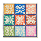 Colorful reusable gift wrap with geometric pattern on a white background
