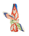 Colorful geometric patterned reusable gift wrap on a white background