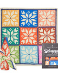 Colorful patterned gift wrap with a decorative bow and packaging on a white background