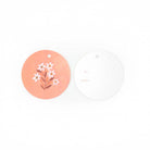 Two gift tags, one peach with floral design and one white with 'To' and 'From' text, on a white background.