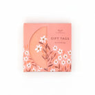 Pack of gift tags with floral design on a white background
