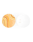 Round gift tag with orange and yellow abstract design on a white background