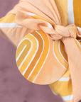 Yellow arch gift tags on a yellow wrapped gift