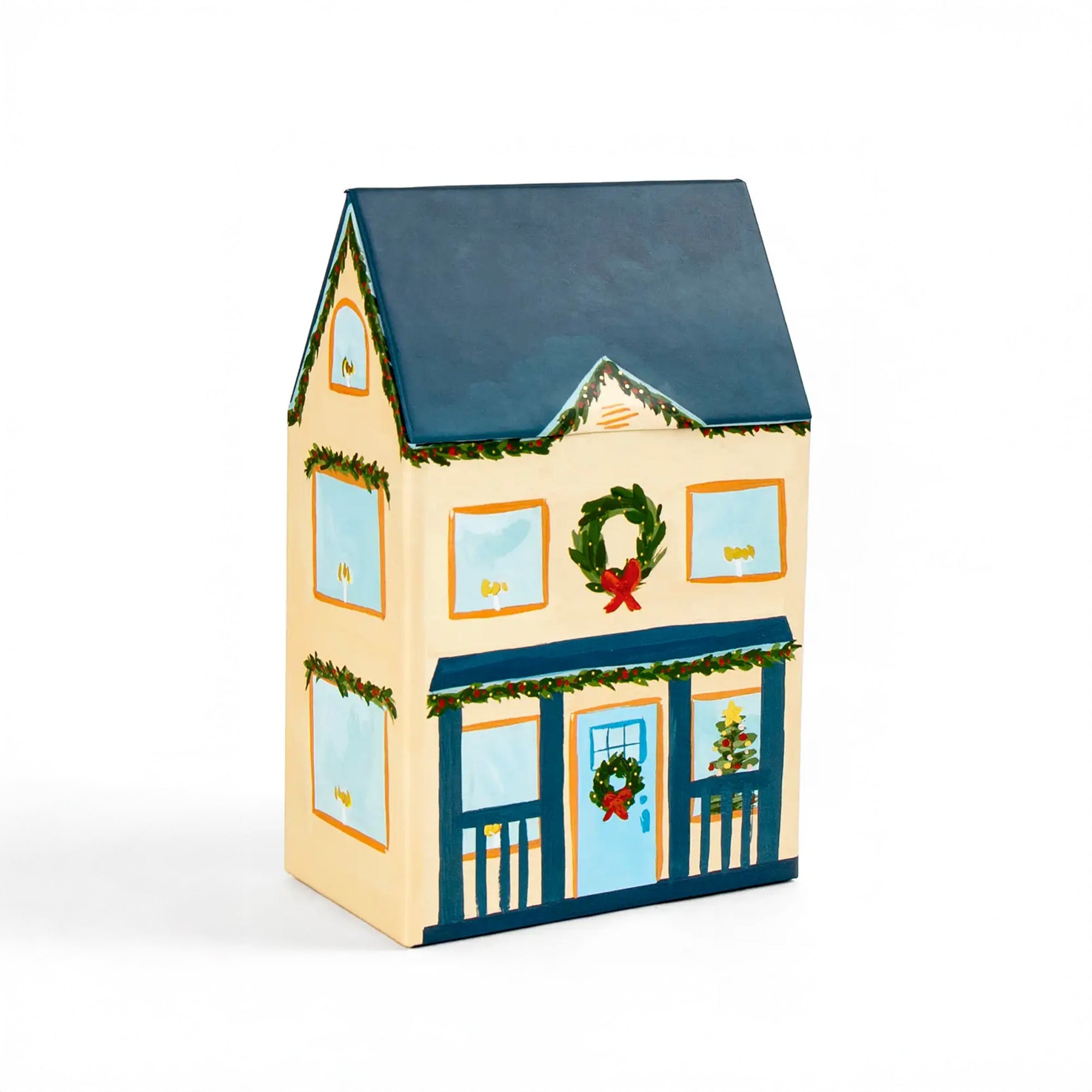 Decorative house-shaped box with Christmas wreaths and ribbons on a white background
