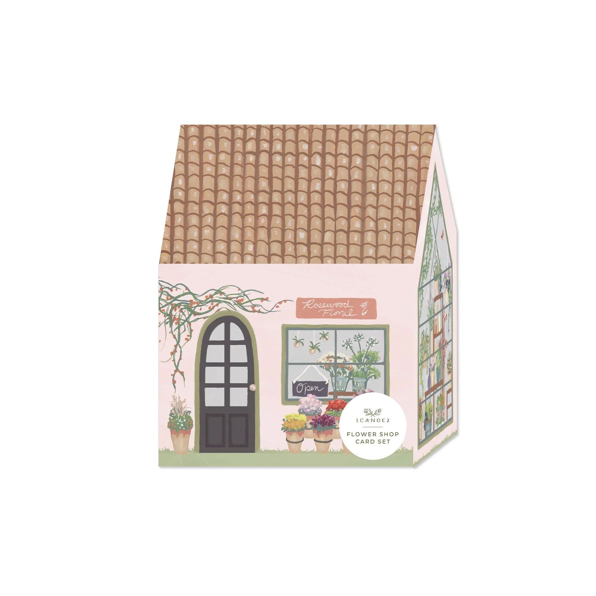 House-shaped card set packaging with a floral design on a white background
