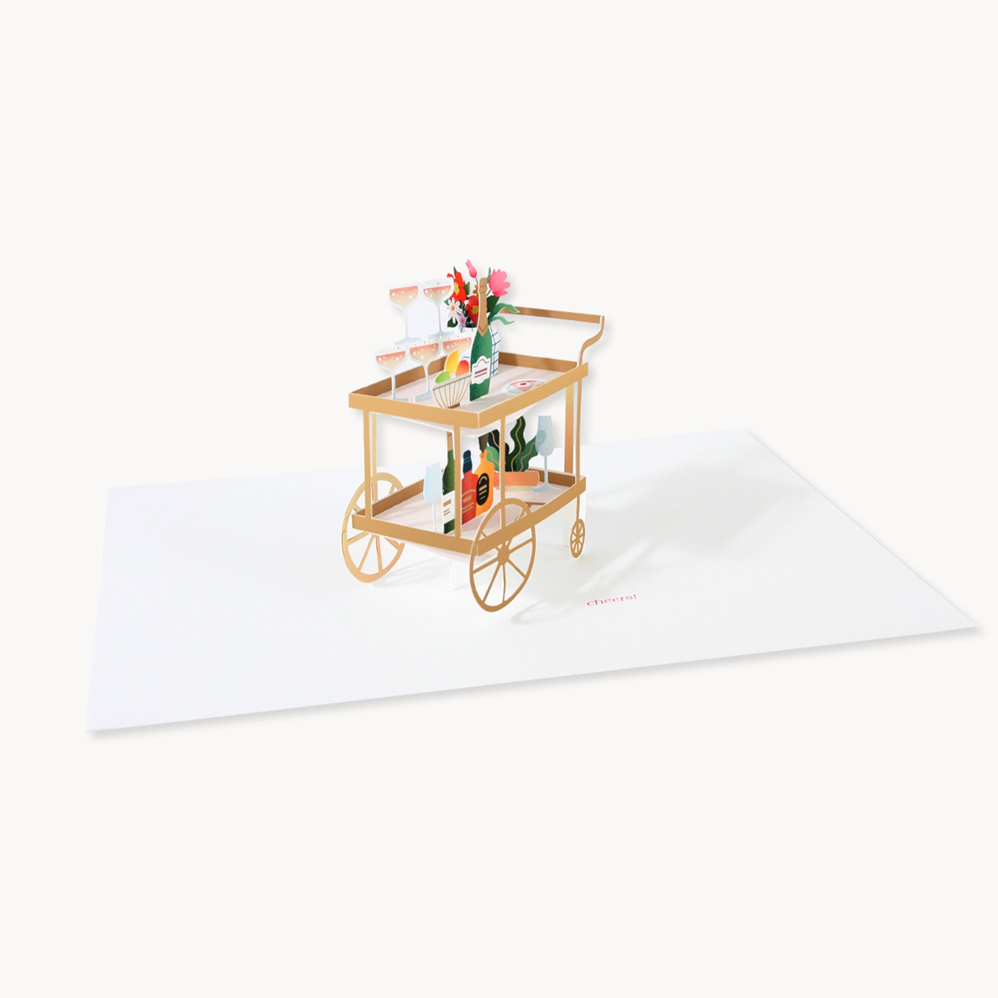 Decorative card with a gold cart holding flowers and bottles on a white background