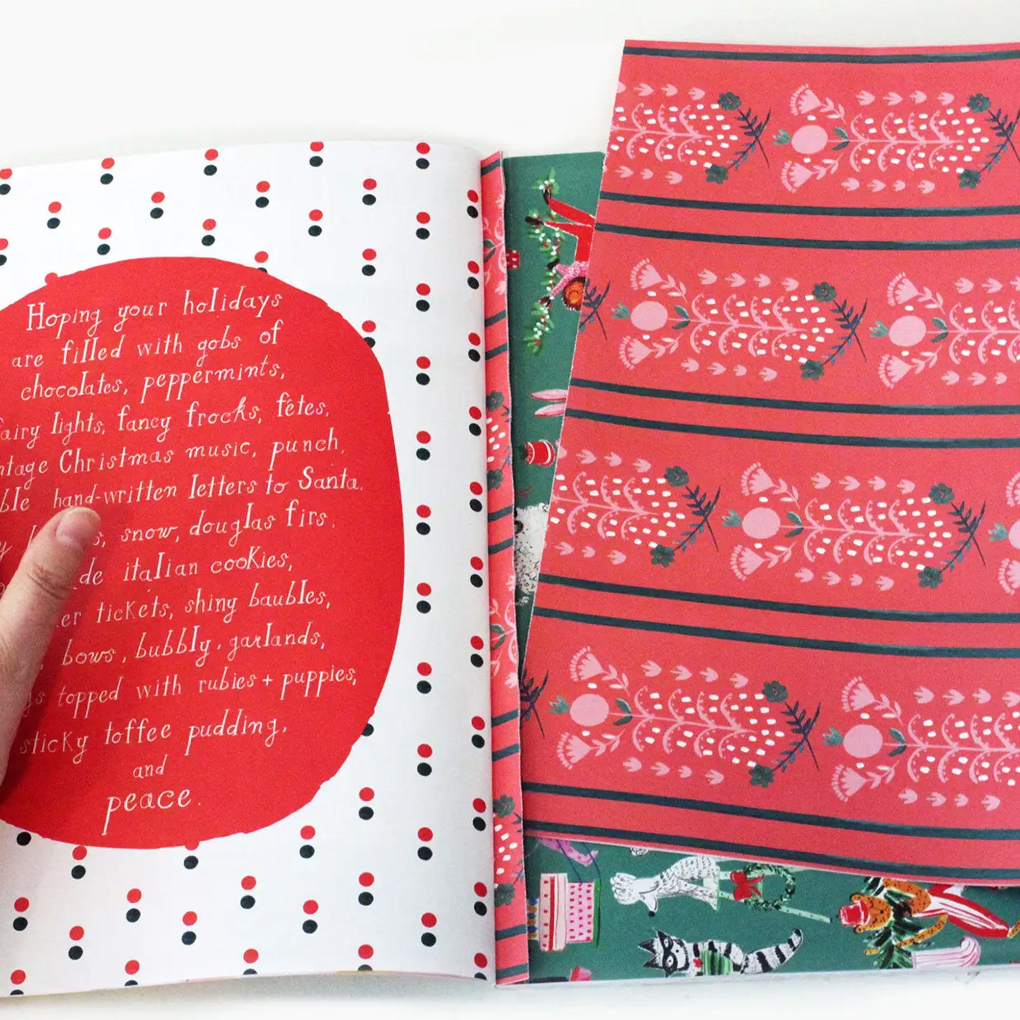 Holiday-themed book with red and white polka dot cover and patterned pages.