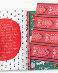 Holiday-themed book with red and white polka dot cover and patterned pages.