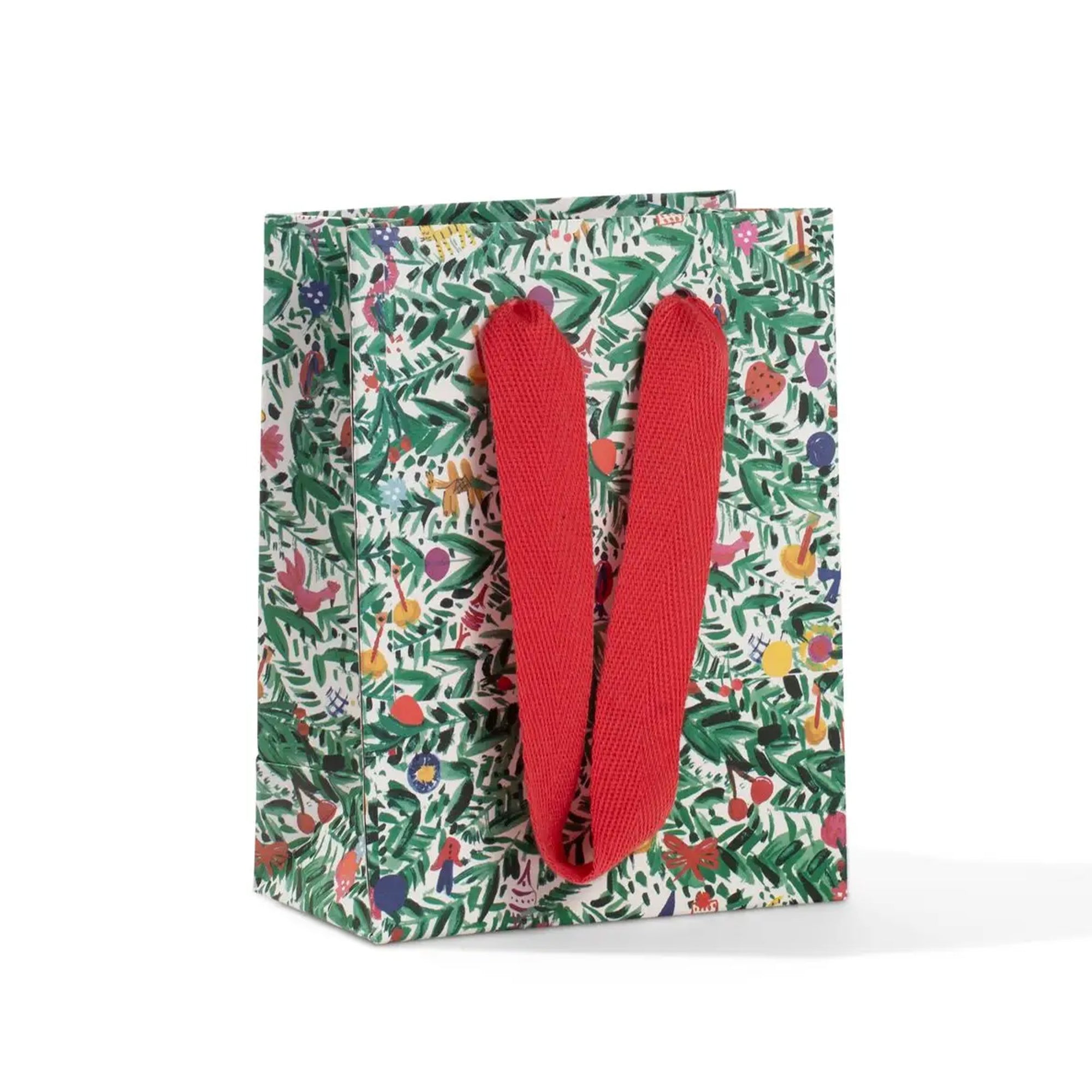 Gift bag with floral pattern and red handles on a white background