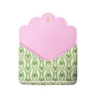 A laptop sleeve featuring a light pink scalloped flap and a green and white damask patterned body, shown on a plain white background.