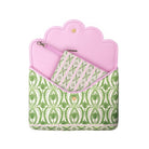 A pink and green patterned pouch with a scalloped pink top edge, shown open against a plain white background.