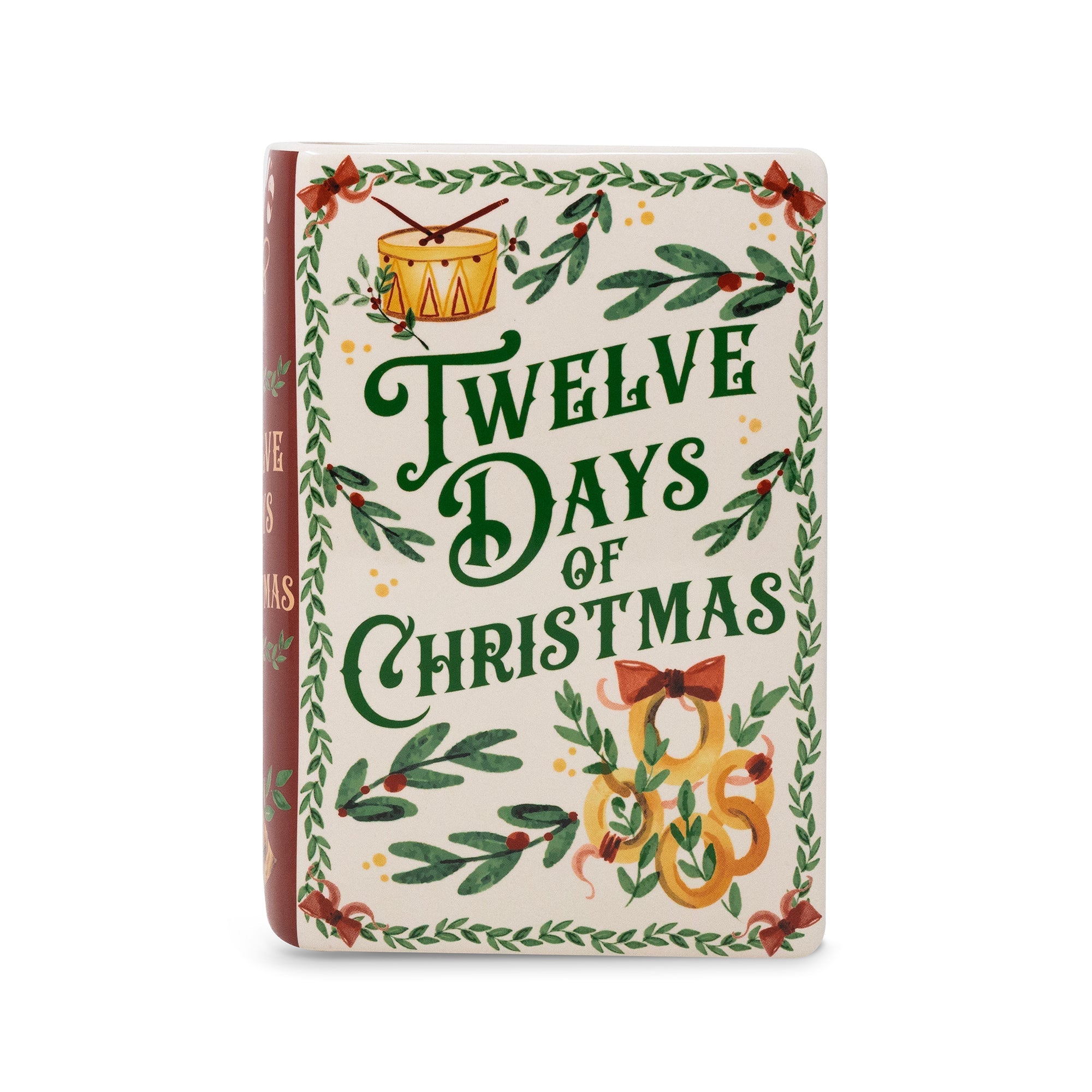 Book vase featuring 'Twelve Days of Christmas' with a cream-colored cover decorated with green holly leaves, red berries, and festive illustrations, shown on a plain white background.
