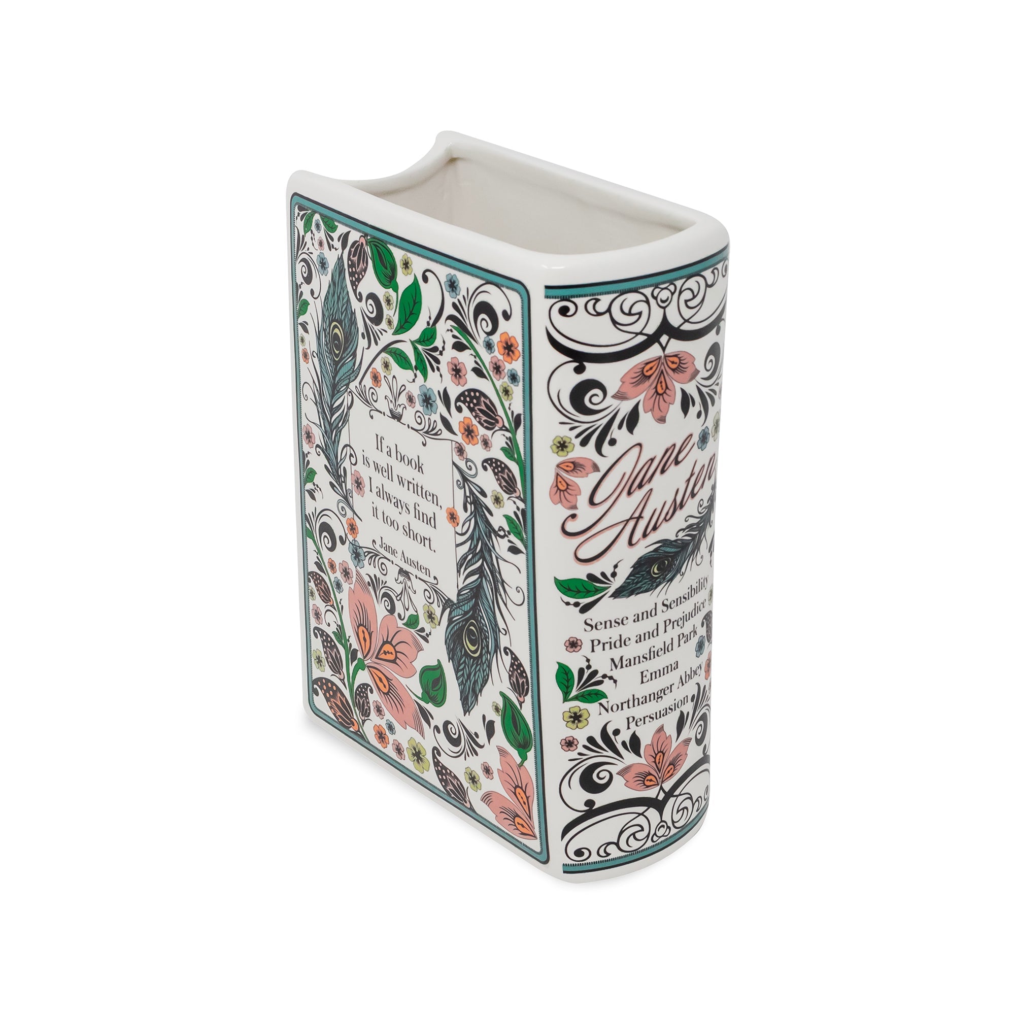 A decorative ceramic book-shaped vase featuring a floral and ornamental print inspired by Jane Austen's 'Pride and Prejudice'. The white ceramic book has a colorful pattern of pink flowers, green leaves, and black scrollwork, with the title and author name printed on the front and side.